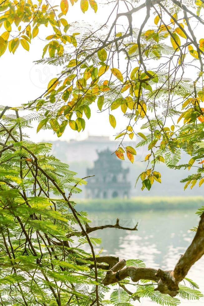 Hoan Kiem Lake - Ho Guom or Sword lake in the center of Hanoi in the fog in the morning. photo