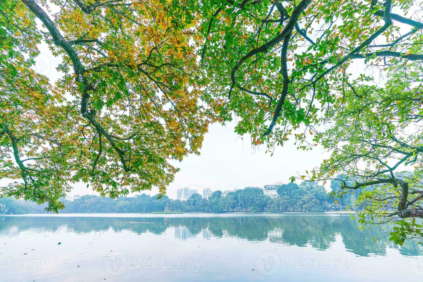 Hoan Kiem Lake - Ho Guom or Sword lake in the center of Hanoi in the fog in the morning. photo