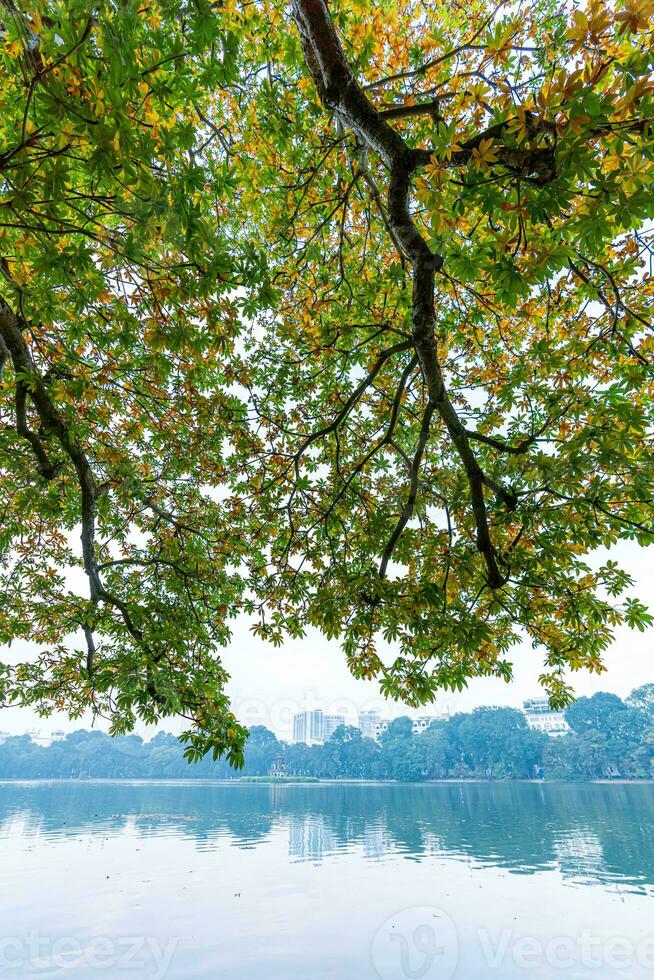 Hoan Kiem Lake - Ho Guom or Sword lake in the center of Hanoi in the fog in the morning. photo
