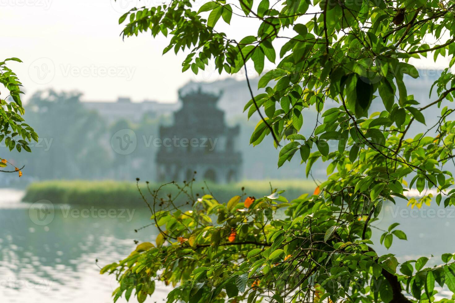 Hoan Kiem Lake - Ho Guom or Sword lake in the center of Hanoi in the fog in the morning. photo