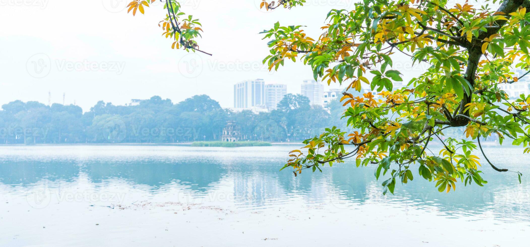 Hoan Kiem Lake - Ho Guom or Sword lake in the center of Hanoi in the fog in the morning. photo