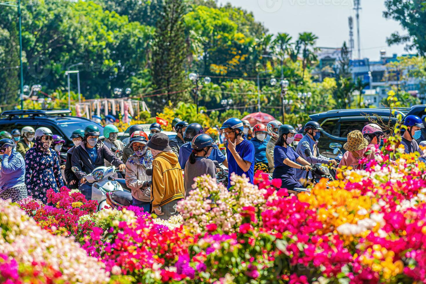 Bustle of buying flowers at flower market, locals buy flowers for decoration purpose the house on Lunar New Year in Ho Chi Minh City, Vietnam. photo