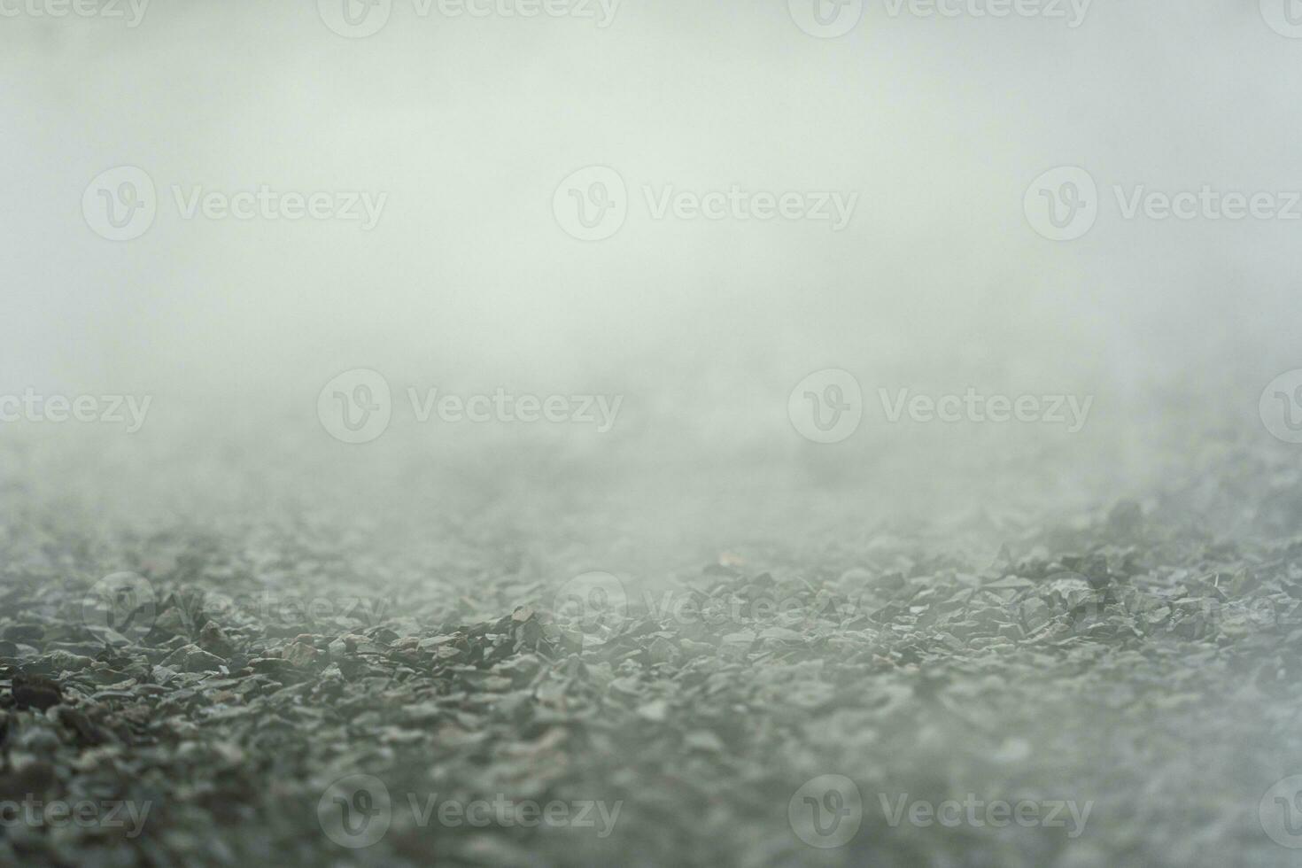 gravel texture floor with mist or fog. Light, dark and gray abstract gravel texture for display products photo