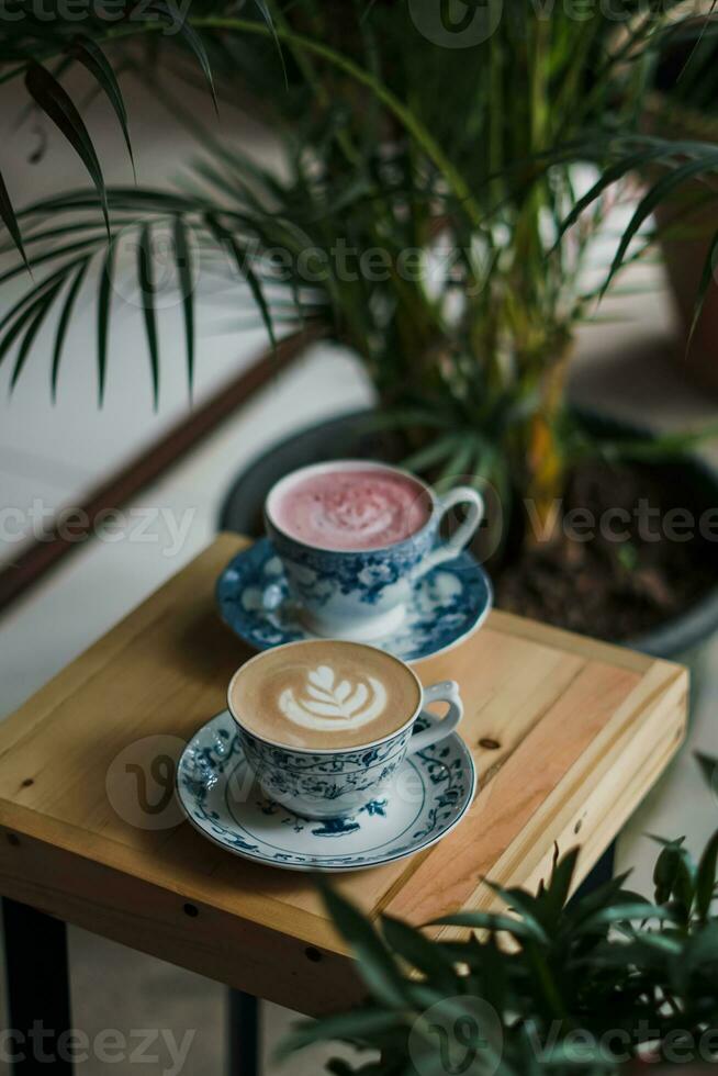 a cup of cappuccino on the table photo