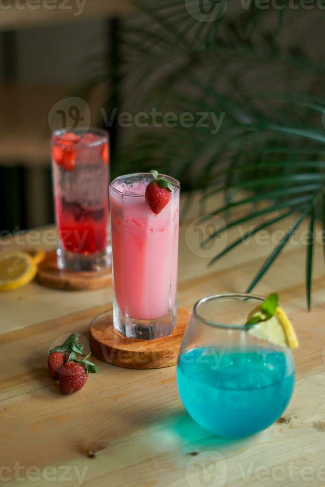 blue and red cocktails with lime for summer drinks photo