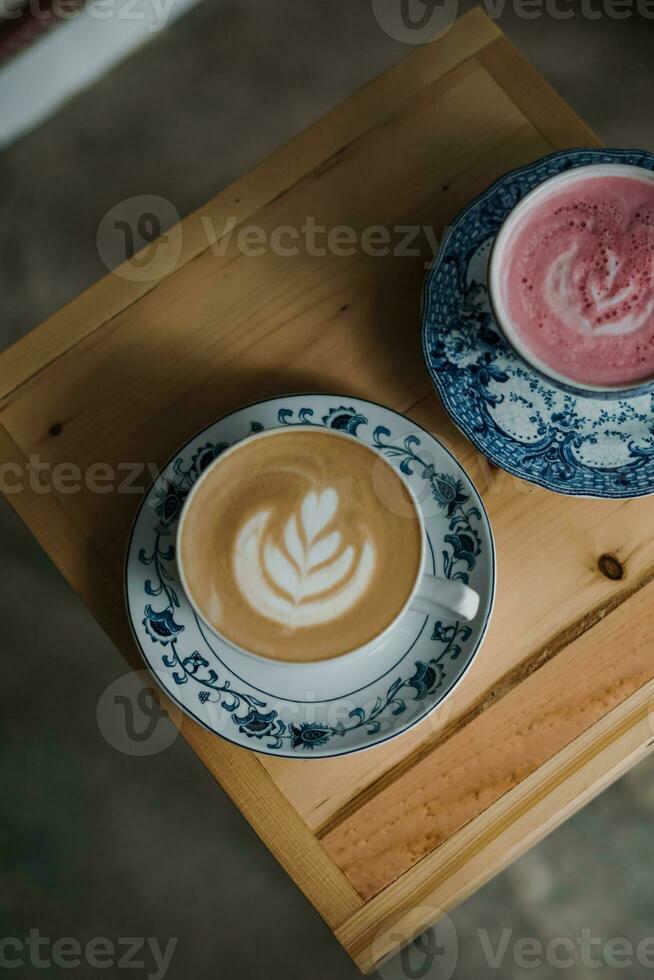 a cup of cappuccino on the table photo