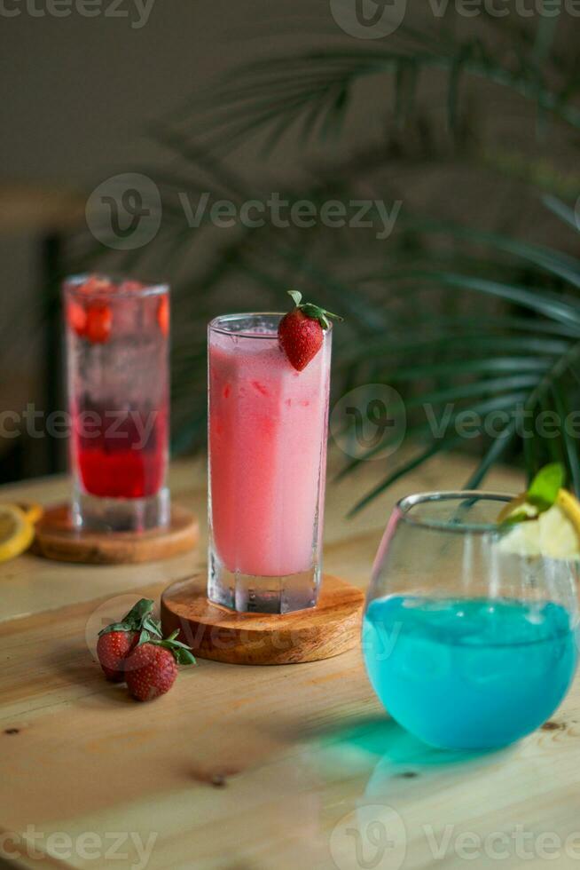 blue and red cocktails with lime for summer drinks photo