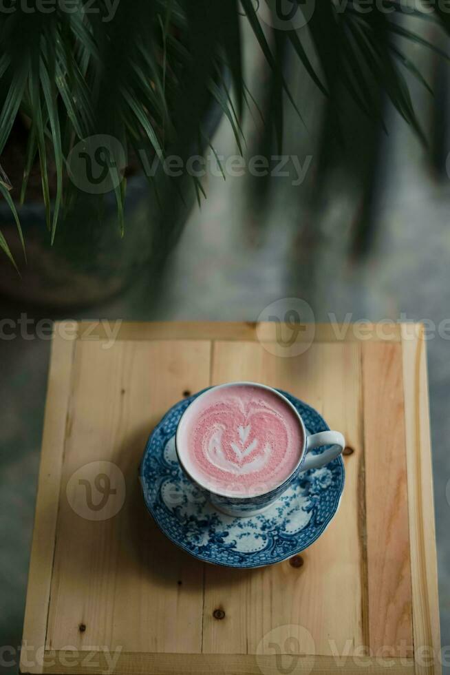 a cup of cappuccino on the table photo