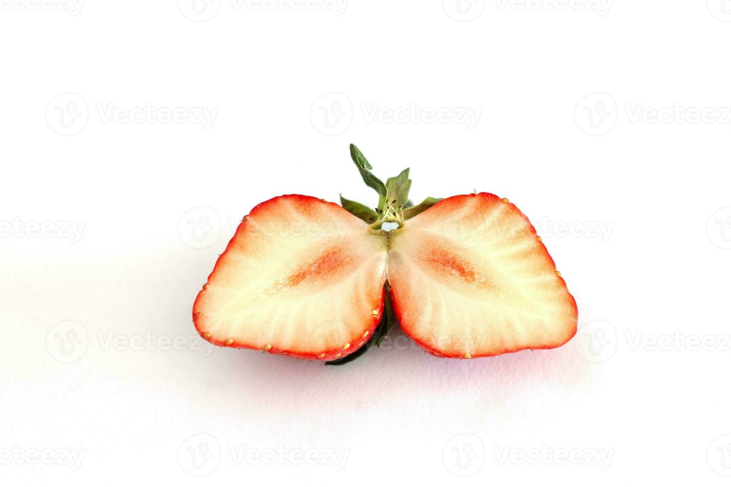 Sliced piece strawberry fruit isolated on white paper background. photo
