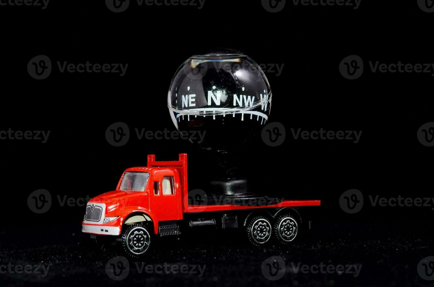 a red truck with a compass on top of it photo