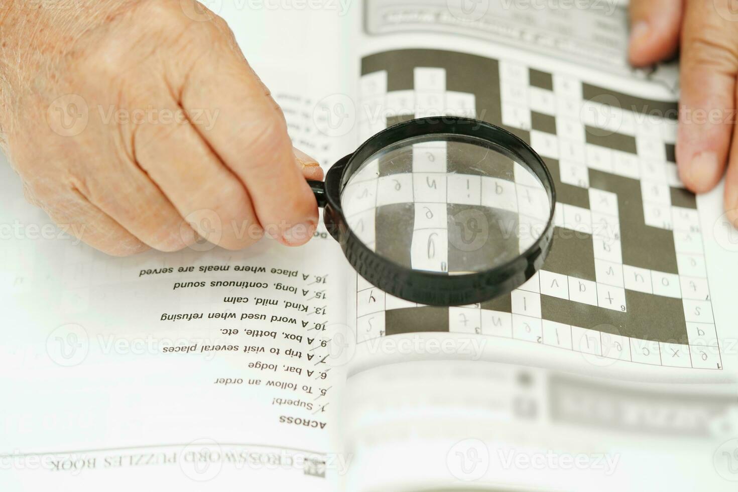 elderly woman playing sudoku puzzle game for treatment dementia prevention and Alzheimer disease. photo