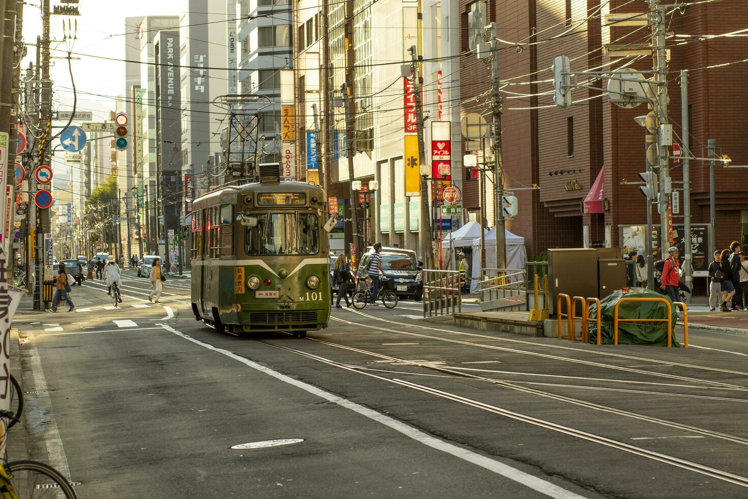 hokkaido japan - octobor 8,2018 old model of supporo city street car ,tram running on track ,sappora is principle city in hokkaido island northern of japan photo