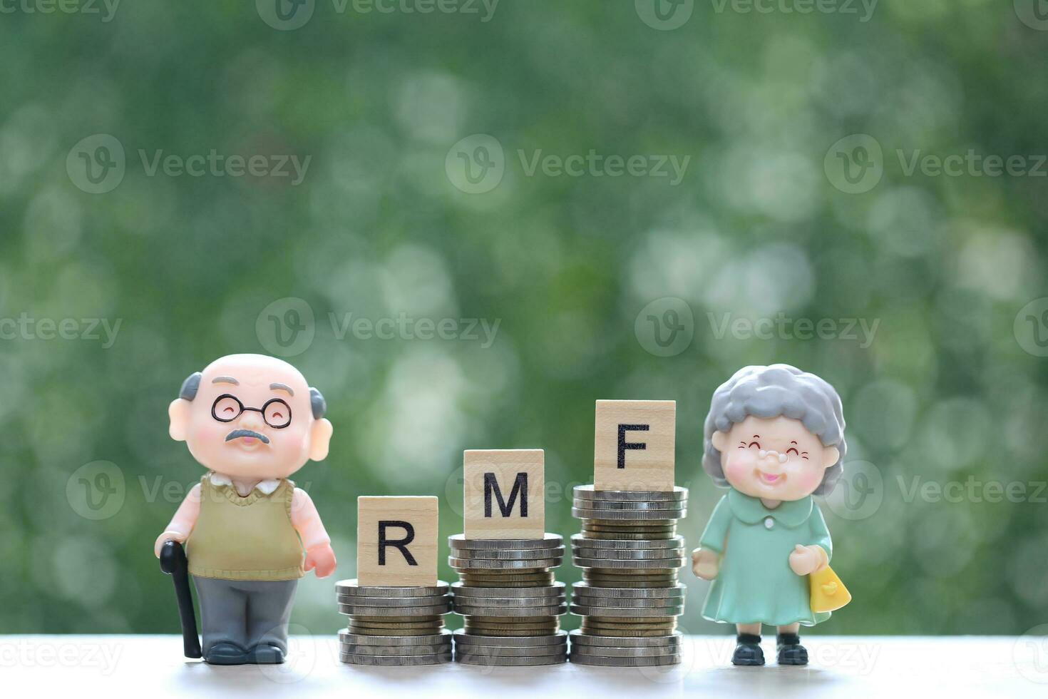Mutual fund,Love couple senior and stack of coins money on natural green background,Save money for prepare in future and pension retirement concept photo