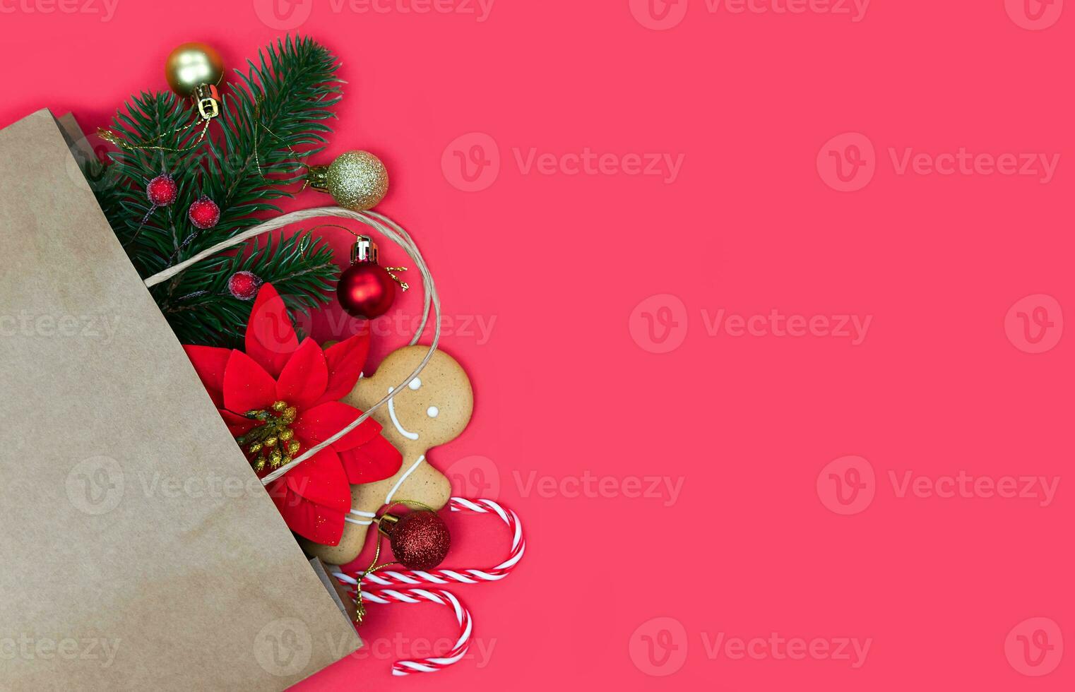 Festive winter composition with Christmas gifts on a red background. Copy space. Flatlay. Top view. Close-up. photo