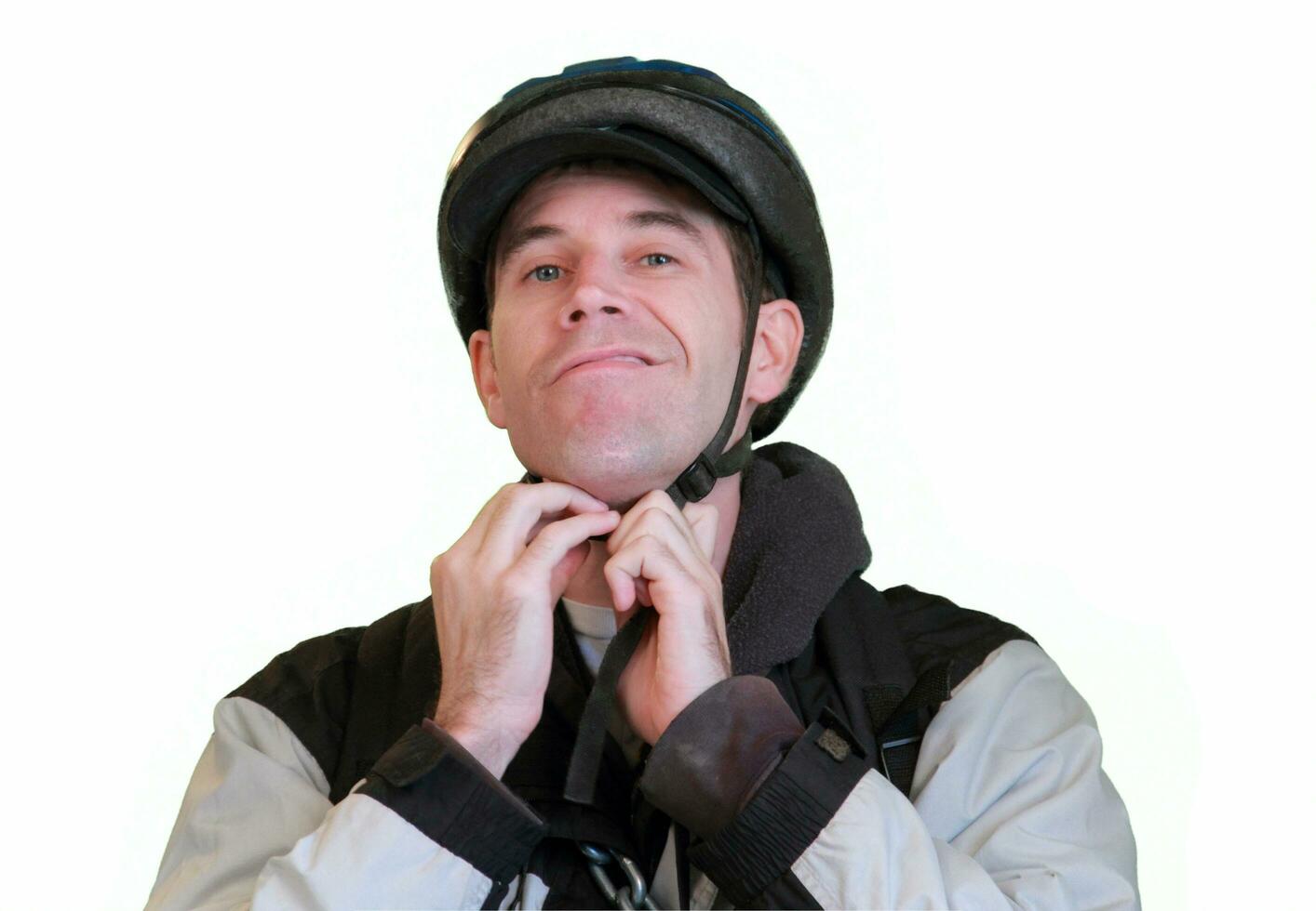 Bicyclist Adjusts Helmet Straps Before a Ride photo