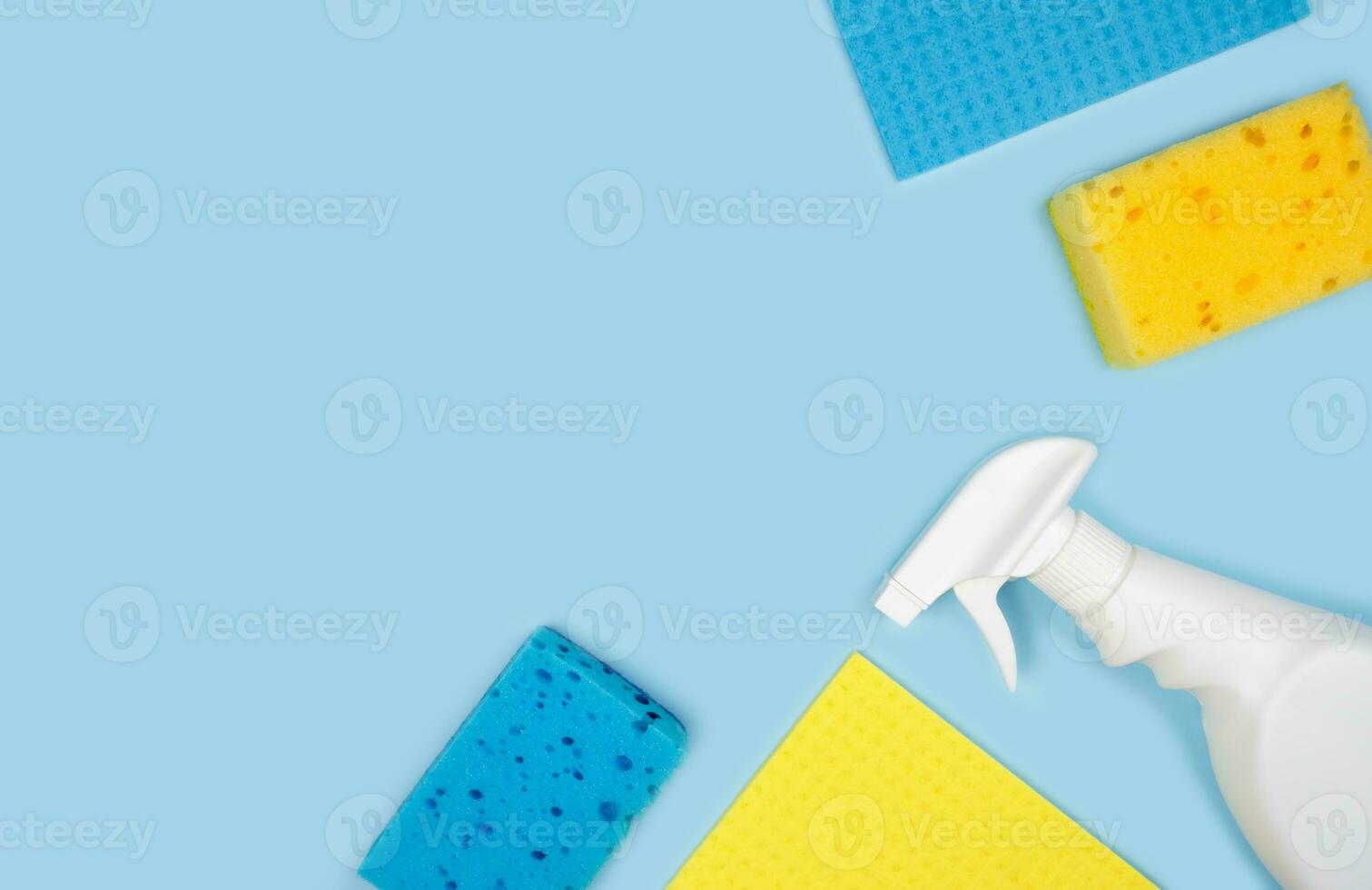 Banner. Cleaning concept. Various cleaning products on a blue background. Top view. Copy space. photo