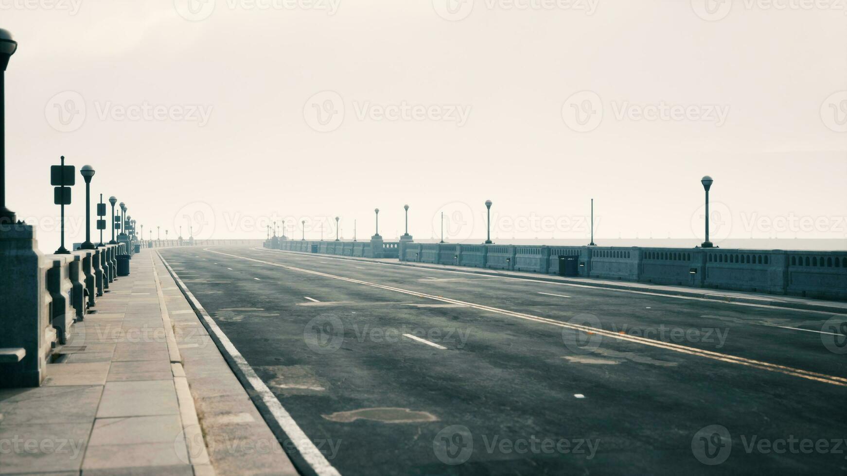 Old empty bridge on a foggy day photo