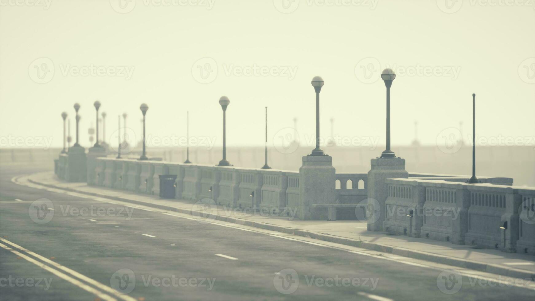 Old empty bridge on a foggy day photo