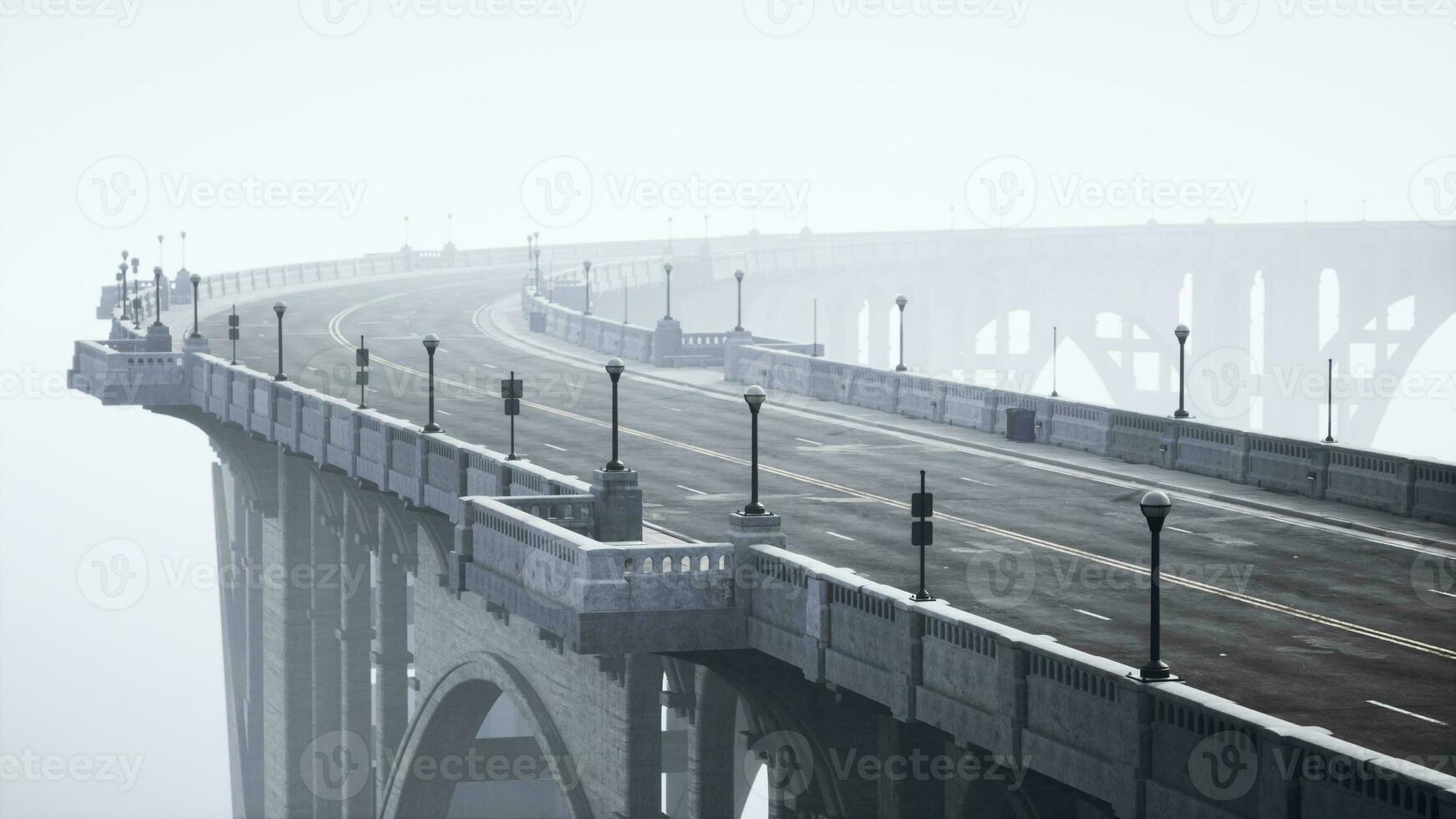 An empty illuminated asphalt road in a thick fog photo
