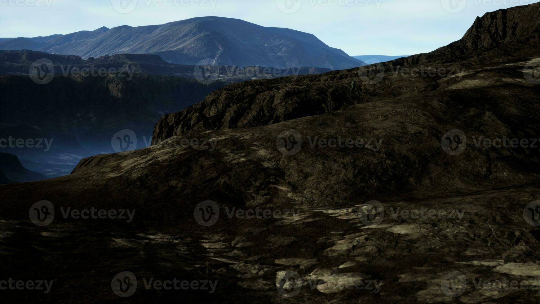 black volcanic basalt rock formations in the low light photo