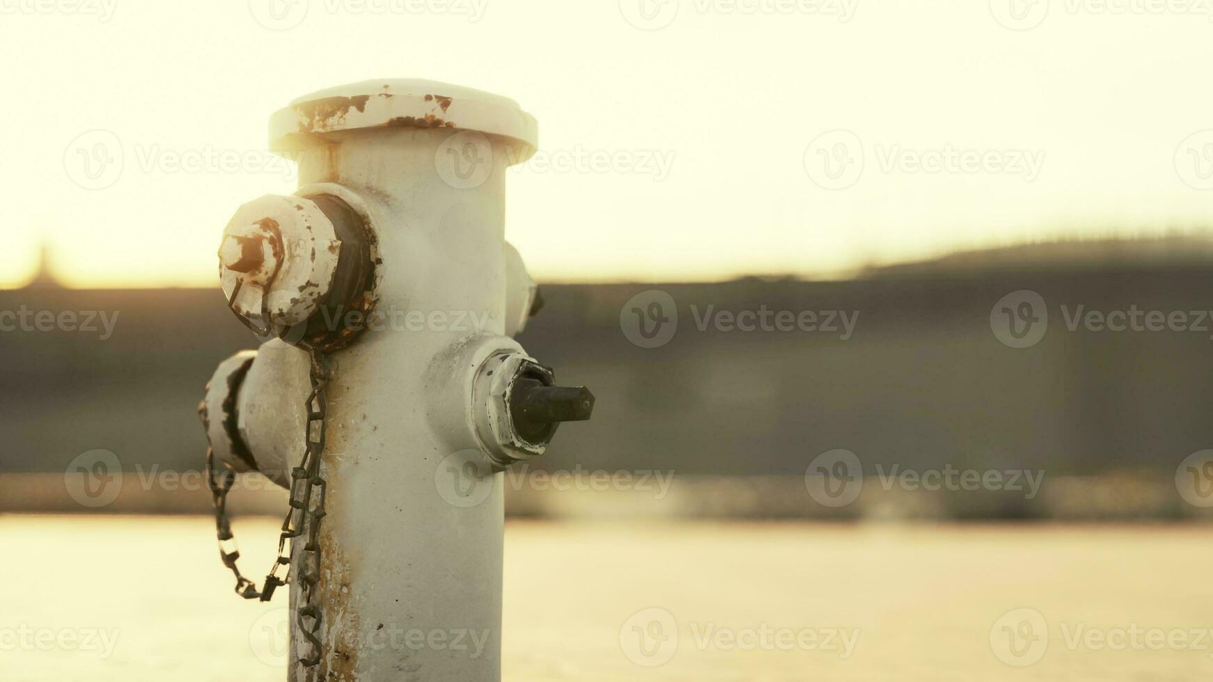 old hydrant on a seaside promenade photo