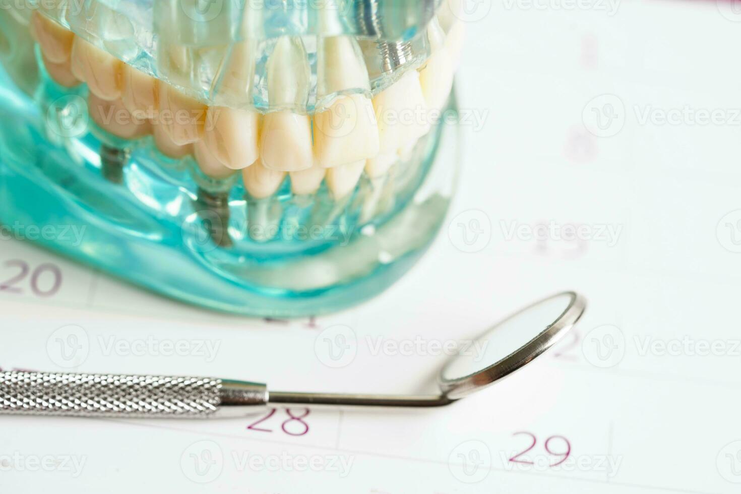 Dental appointment reminder in calendar, healthy teeth, dental health care. photo
