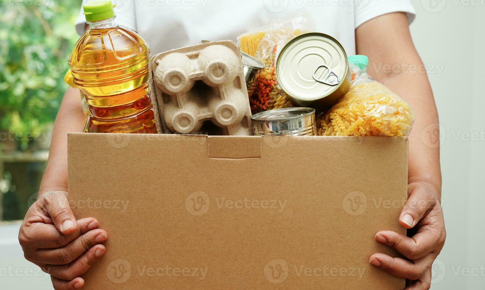 Foodstuffs in donation box for volunteer to help people. photo