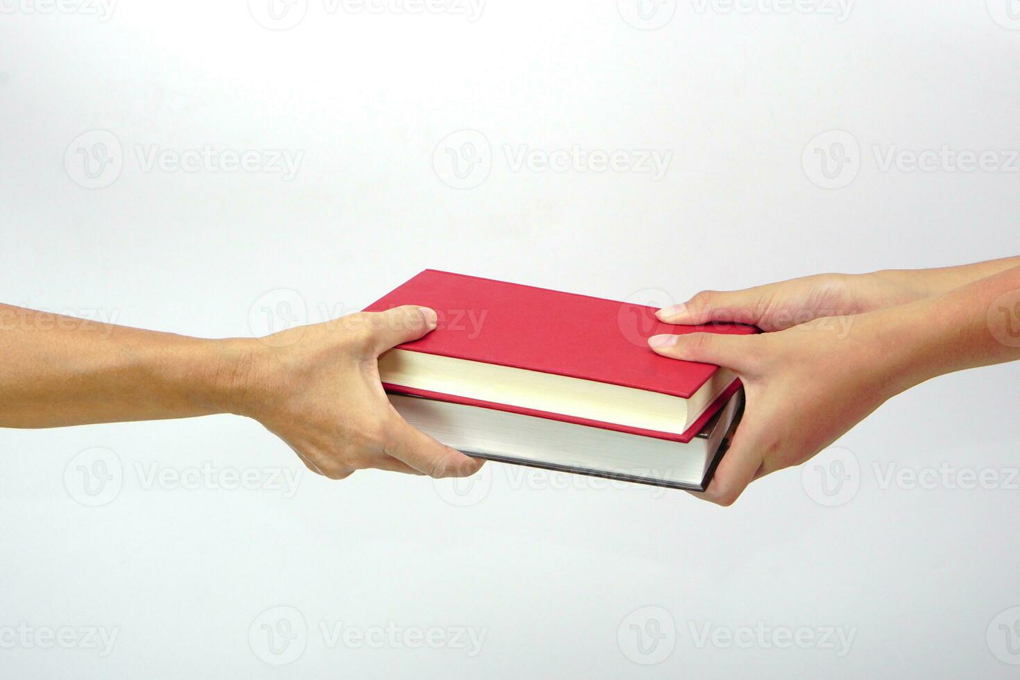 Two people exchanging books or sharing books on white background. exchanging knowledge and education concept. photo