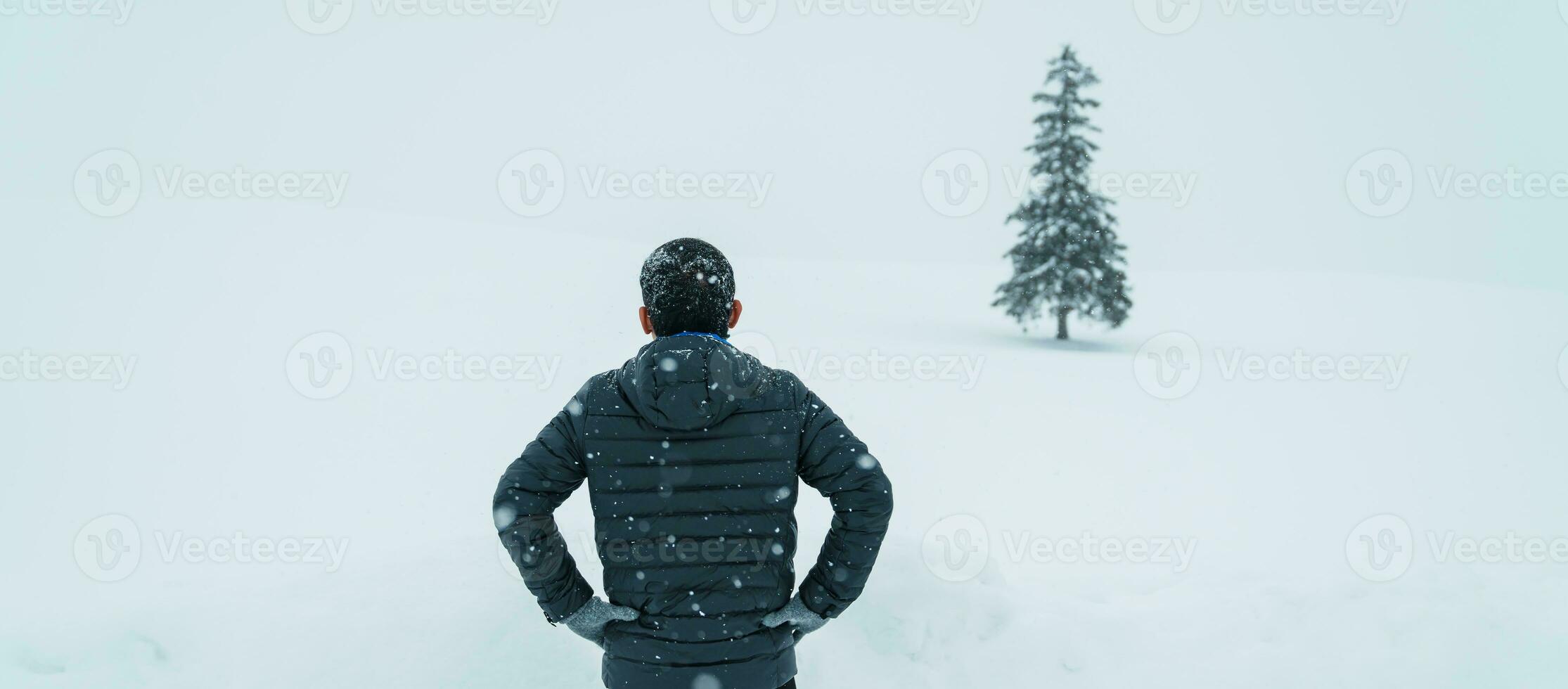 man tourist Visiting in Biei, Traveler in Sweater sightseeing Christmas tree with Snow in winter season. landmark and popular for attractions in Hokkaido, Japan. Travel and Vacation concept photo