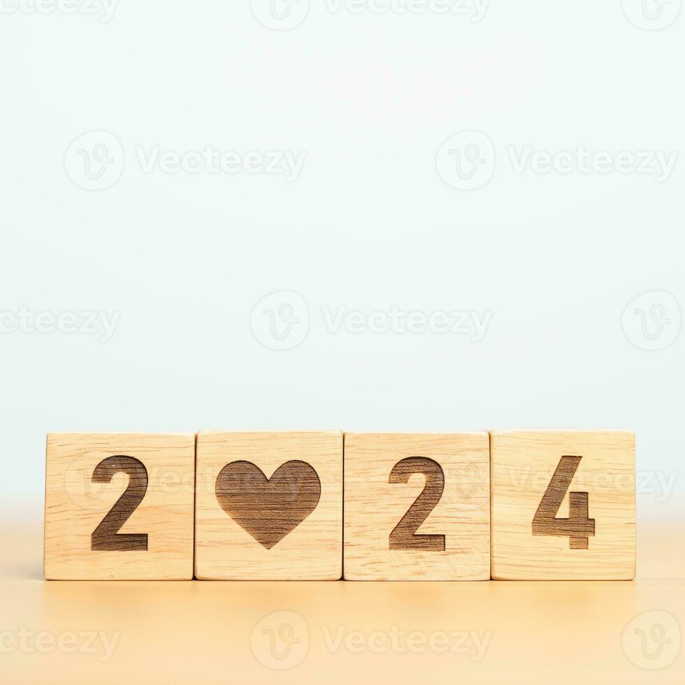 Happy New Year 2024 with heart block for health care, love, organ donation, resolution, charity, happy family, wellbeing and insurance concepts photo