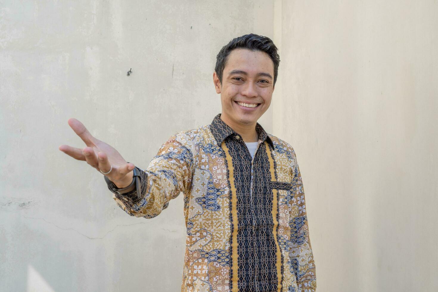 Young Indonesian wear batik traditional culture of Indonesia with click link thumbnail photo