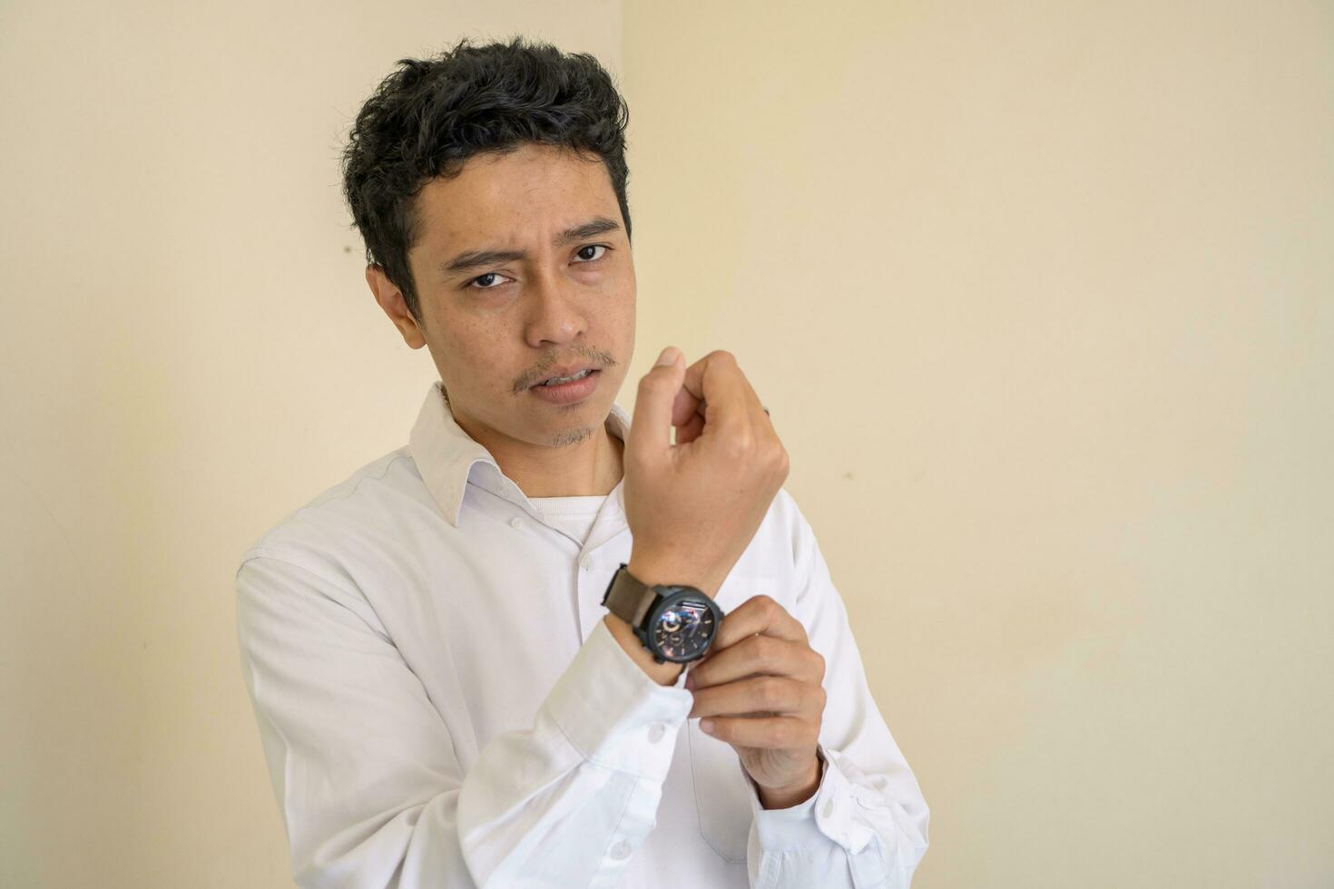 Young adult Indonesian wear the wrist and white clothes. photo