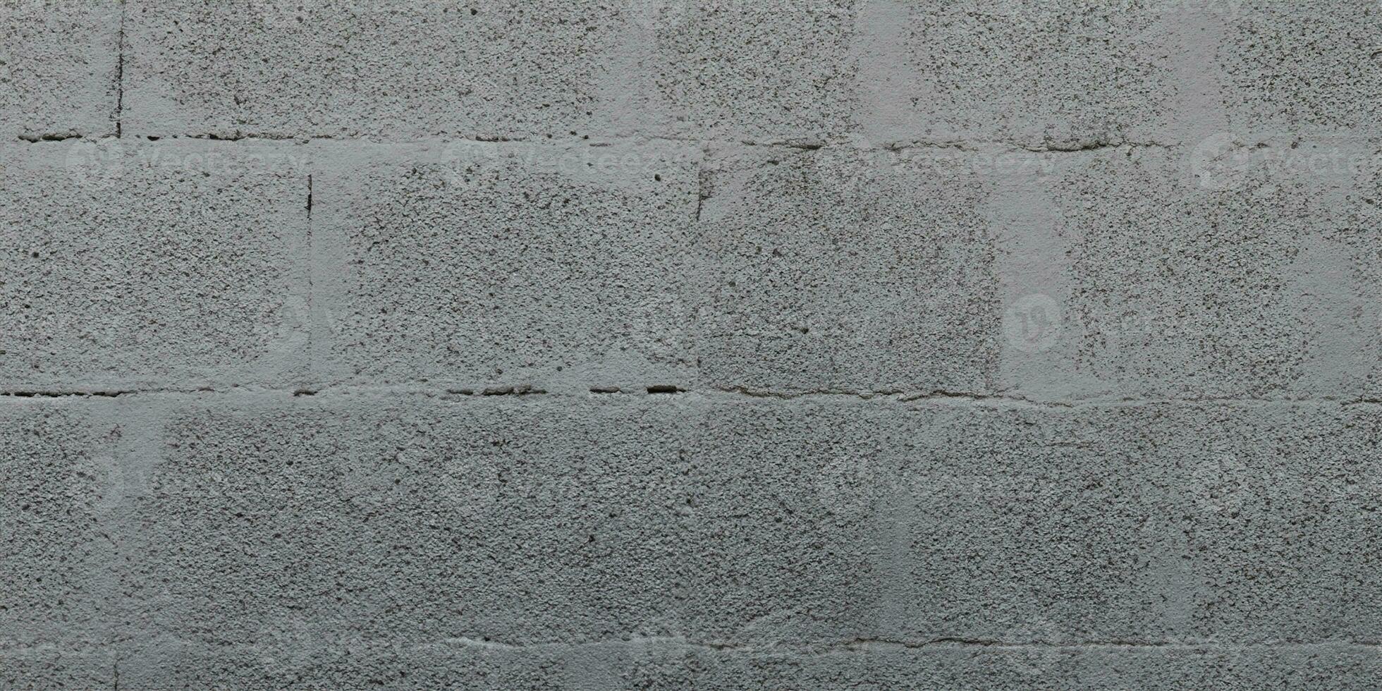 Grey cinderblock brick wall for background gray blockwork texture photo