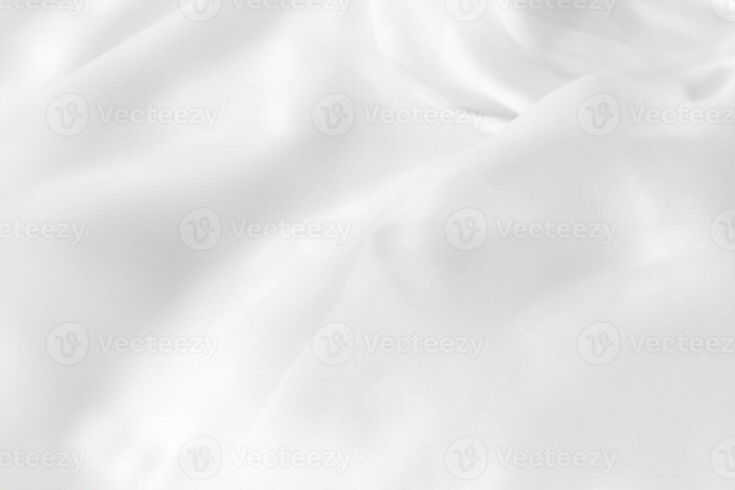 Close up top view of white bedding sheet and wrinkle messy blanket in bedroom after wake up in the morning. photo