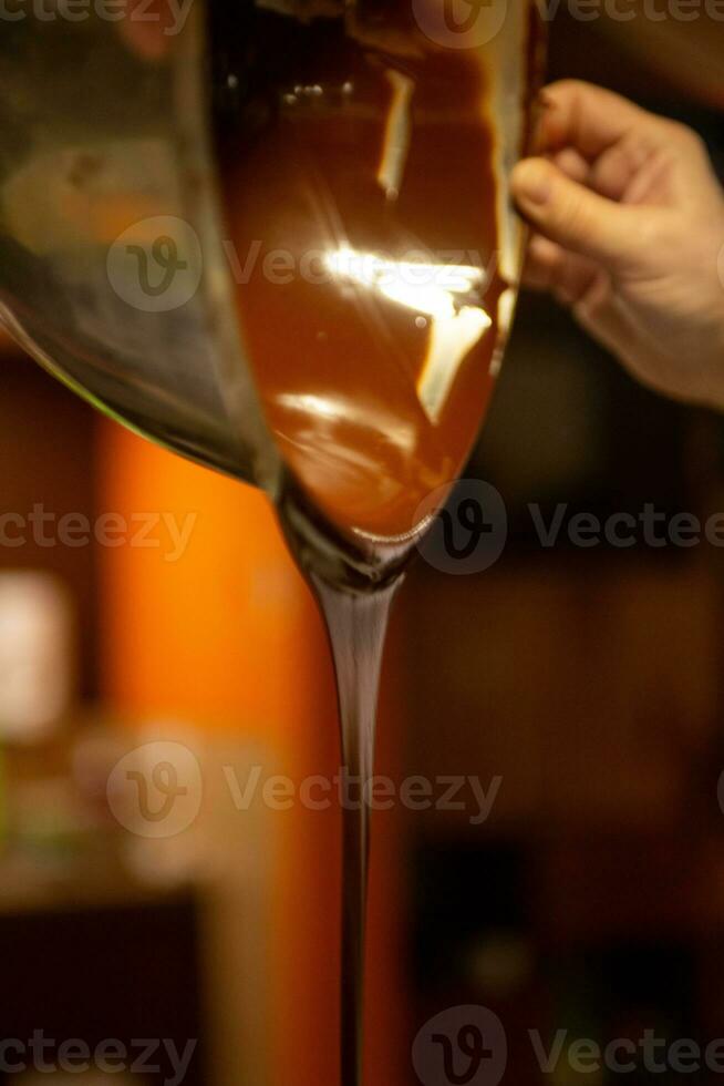 Chocolatier Pouring Chocolate photo