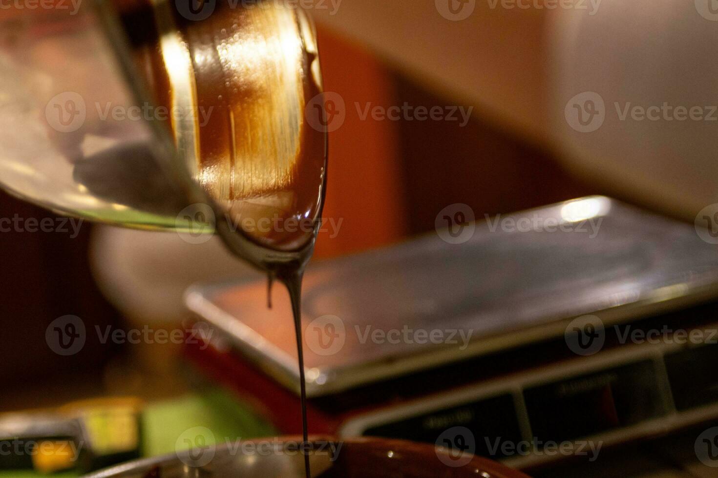 Chocolatier Pouring Chocolate photo