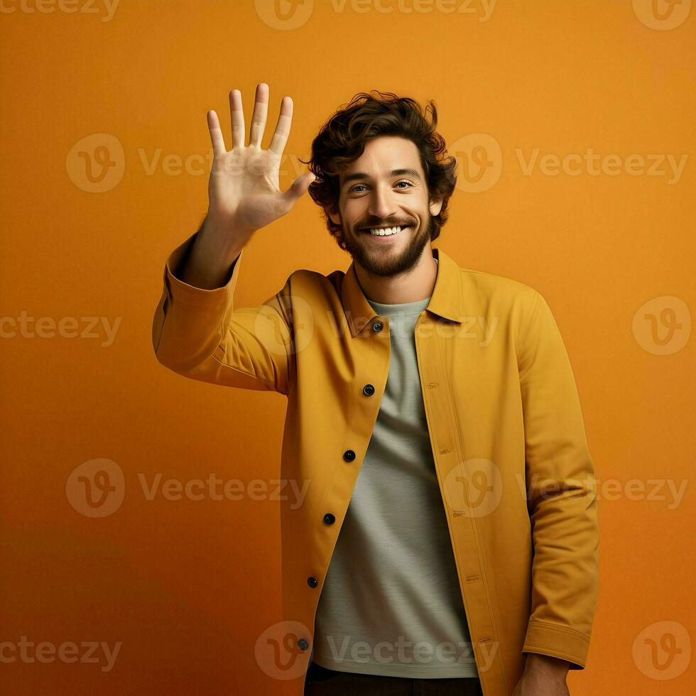 ai generado foto de el sonriente hombre ondulación su mano en un amarillo antecedentes. alto calidad. ai generativo