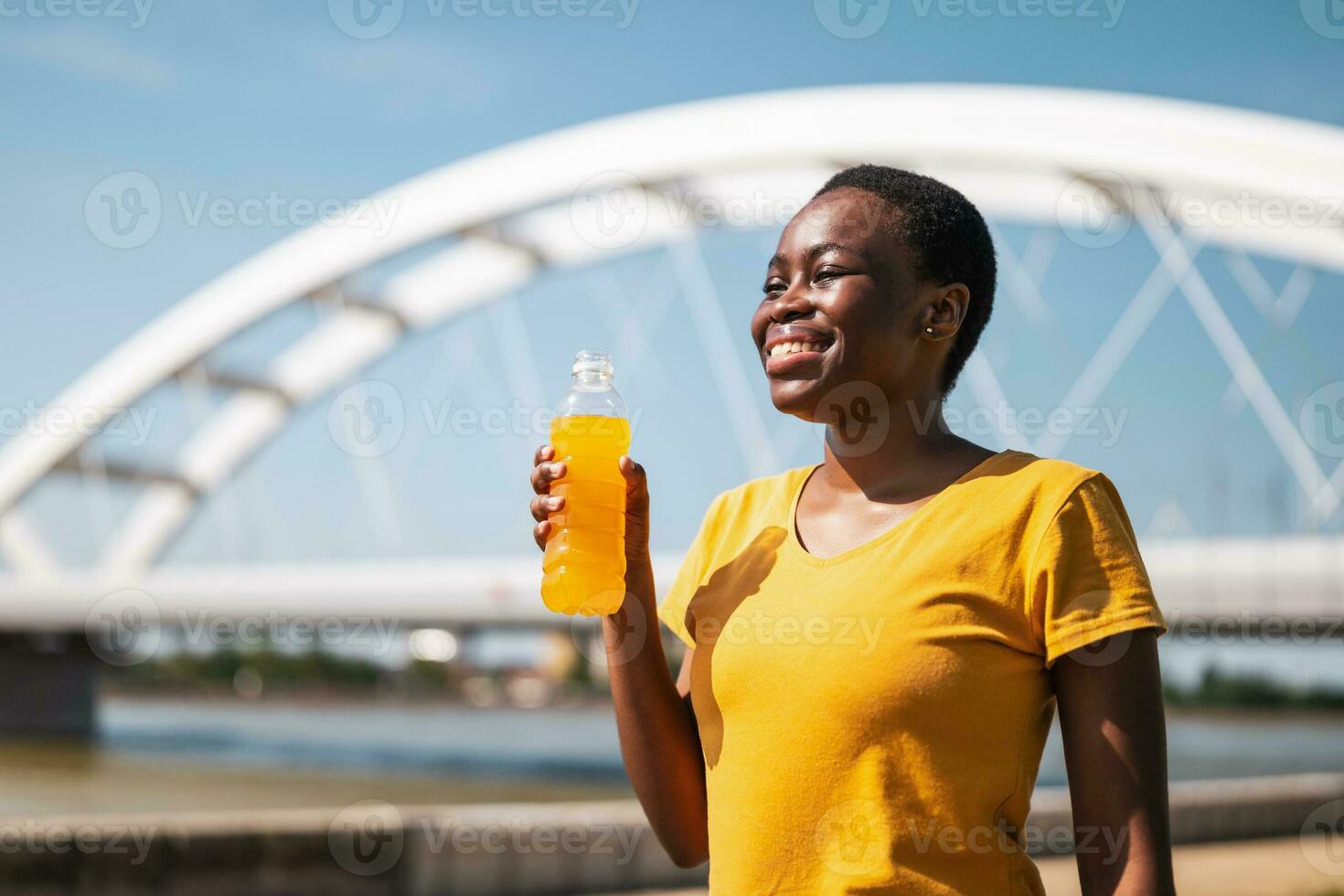 Woman drinking energy drink while exercise outdoor 35033287 Stock Photo