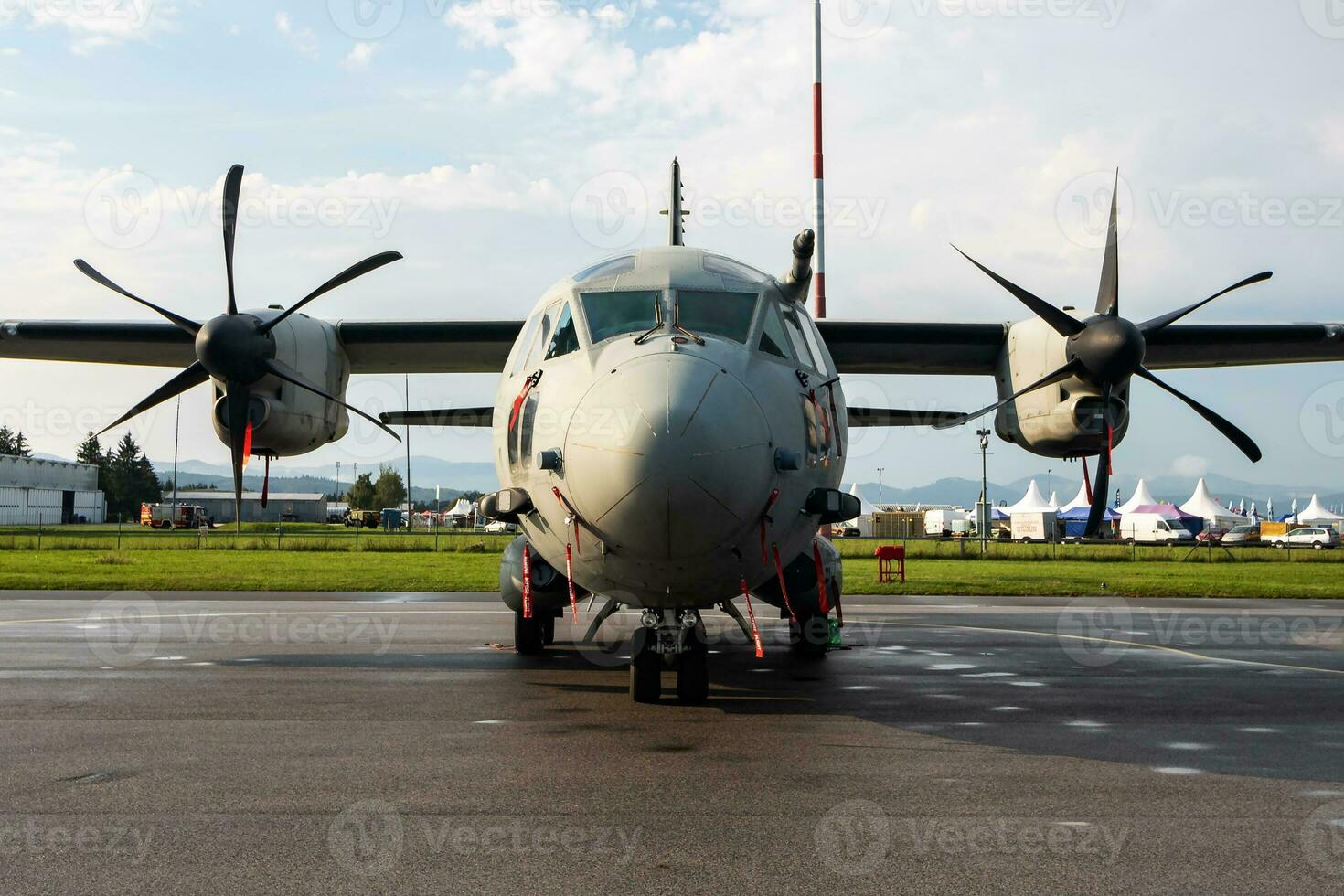 Untitled military transport plane at air base. Airport and airfield. Air force and army flight operation. Aviation and aircraft. Air lift. Military industry. Fly and flying. photo