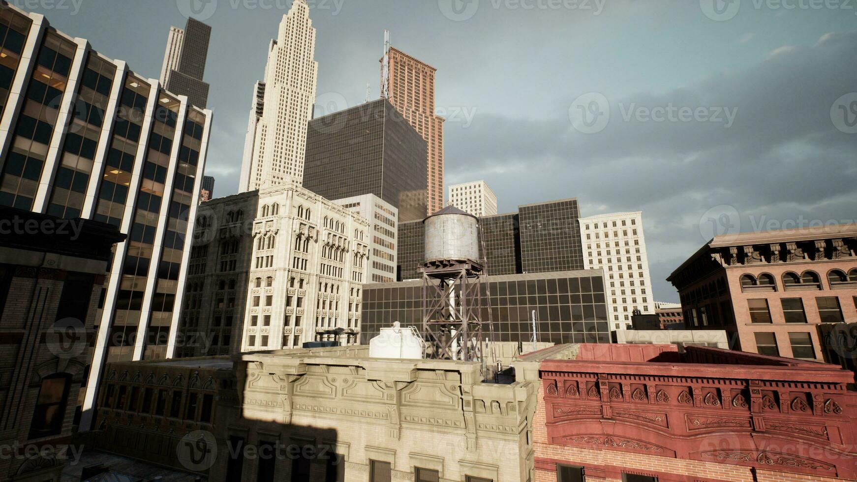 rooftops of its tallest buildings as the sun sets photo