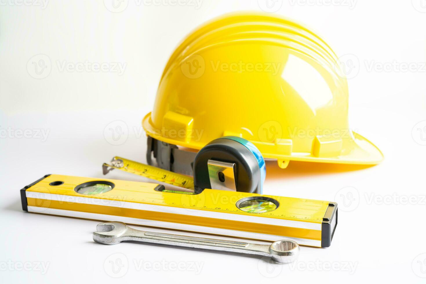 Architectural house plan project blueprint and yellow helmet with calculator, engineer construction tools. photo