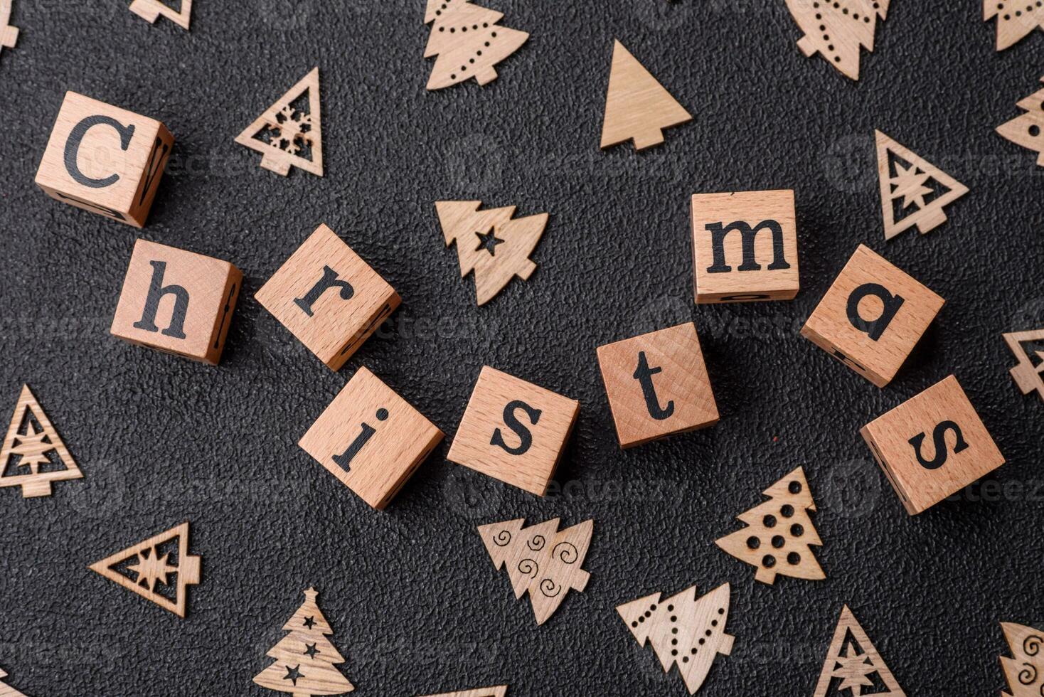 Beautiful Christmas composition with copy space with an inscription in wooden cubes photo