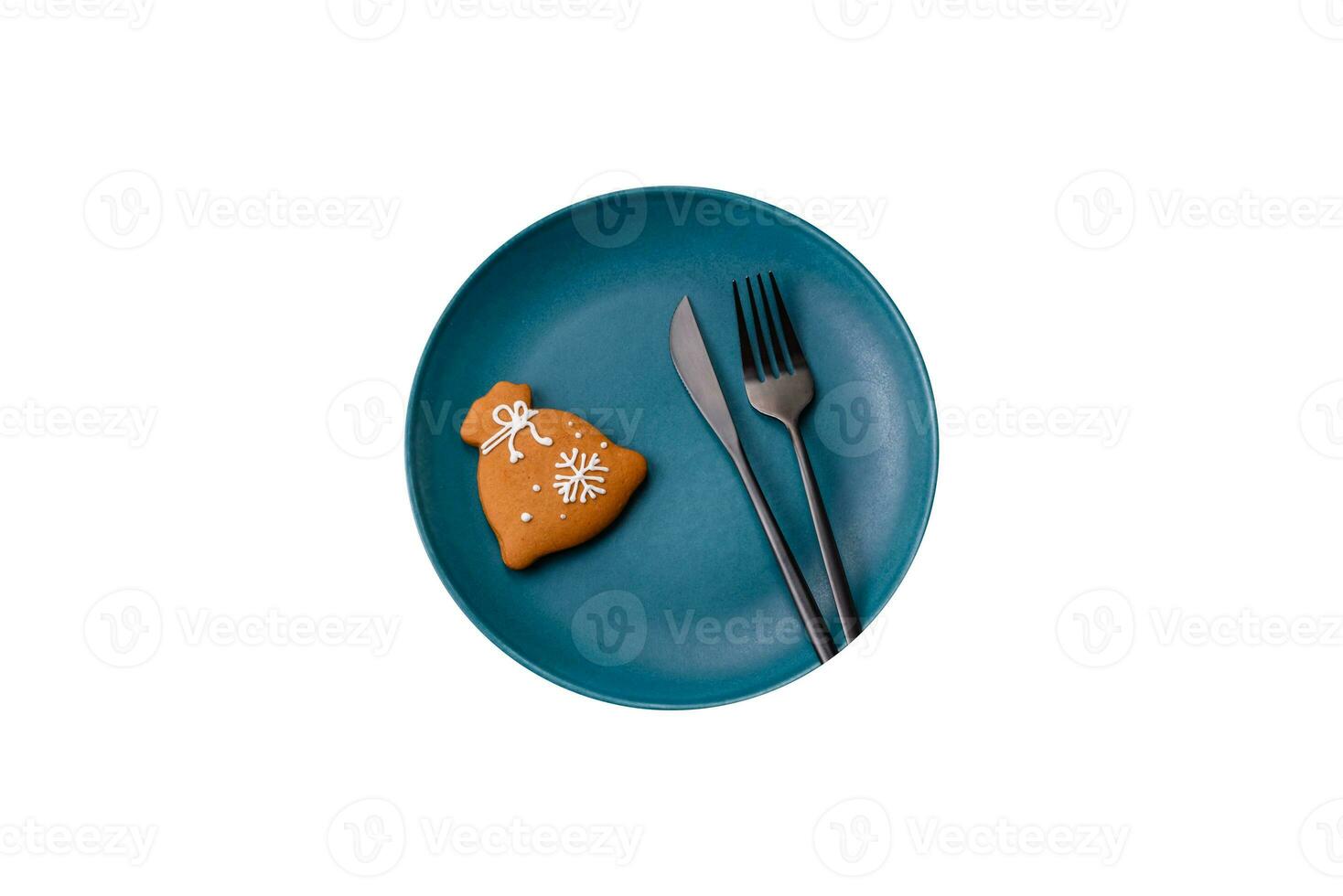 Beautiful festive Christmas composition of an empty plate, tangerine and gingerbreads photo