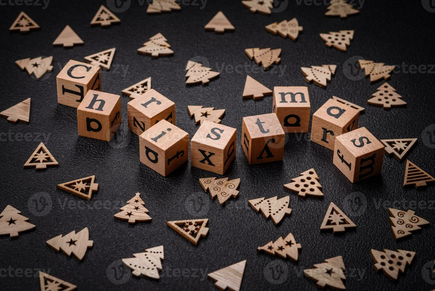 Beautiful Christmas composition with copy space with an inscription in wooden cubes photo