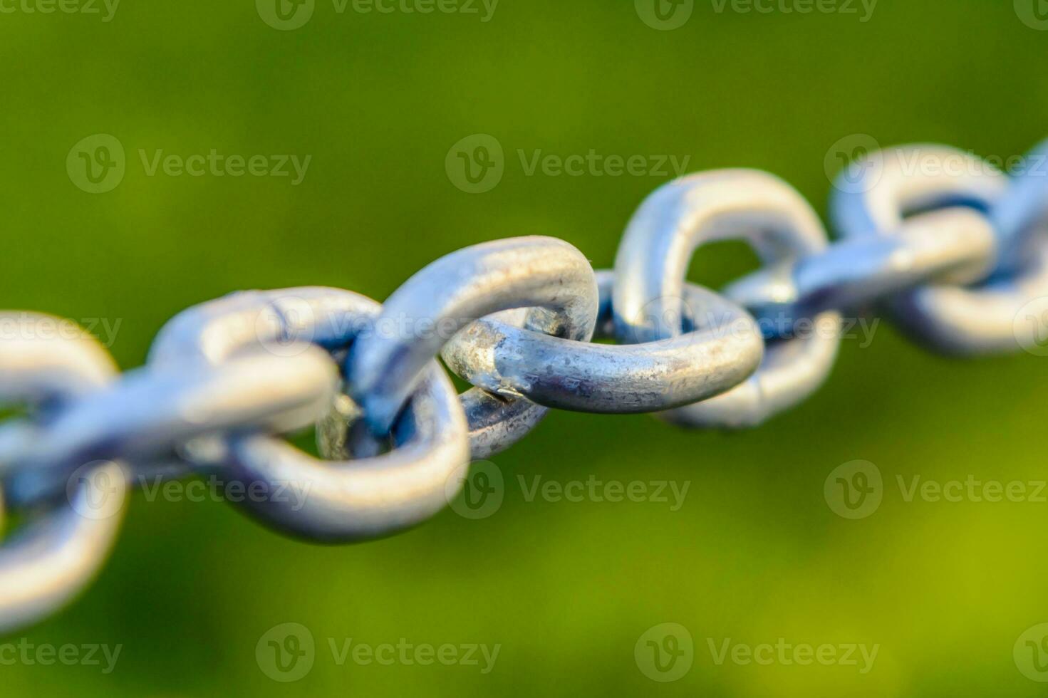 metal chain closeup stretched in the street photo