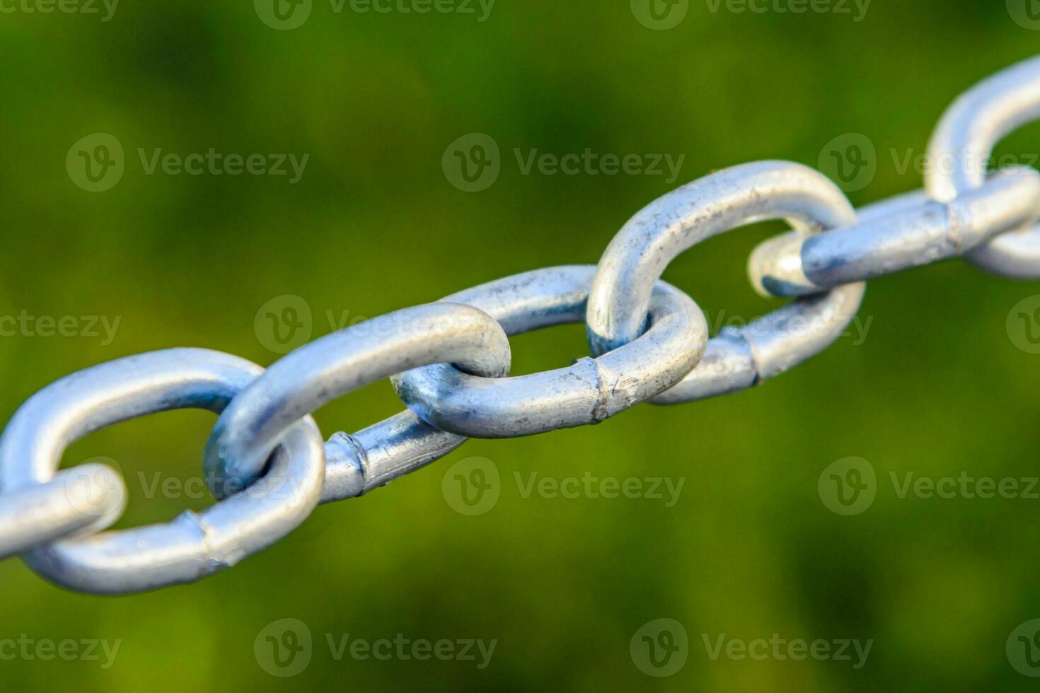 metal chain closeup stretched in the street photo