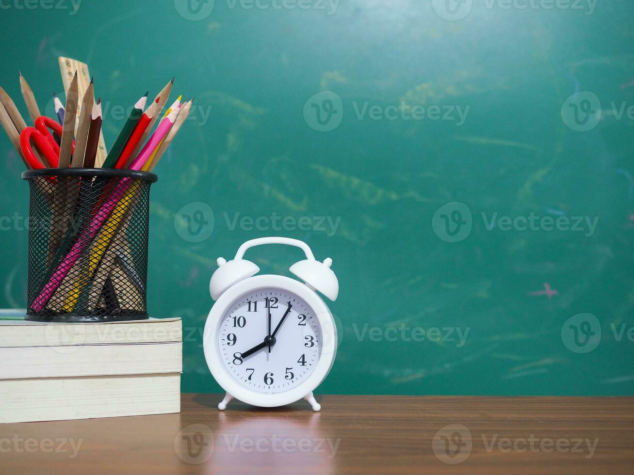 Office desk table, Student creative desktop with colorful stationery on hardcover book and Piggy bank with graduation hat. Copy space for text, Back to school, Education concept photo