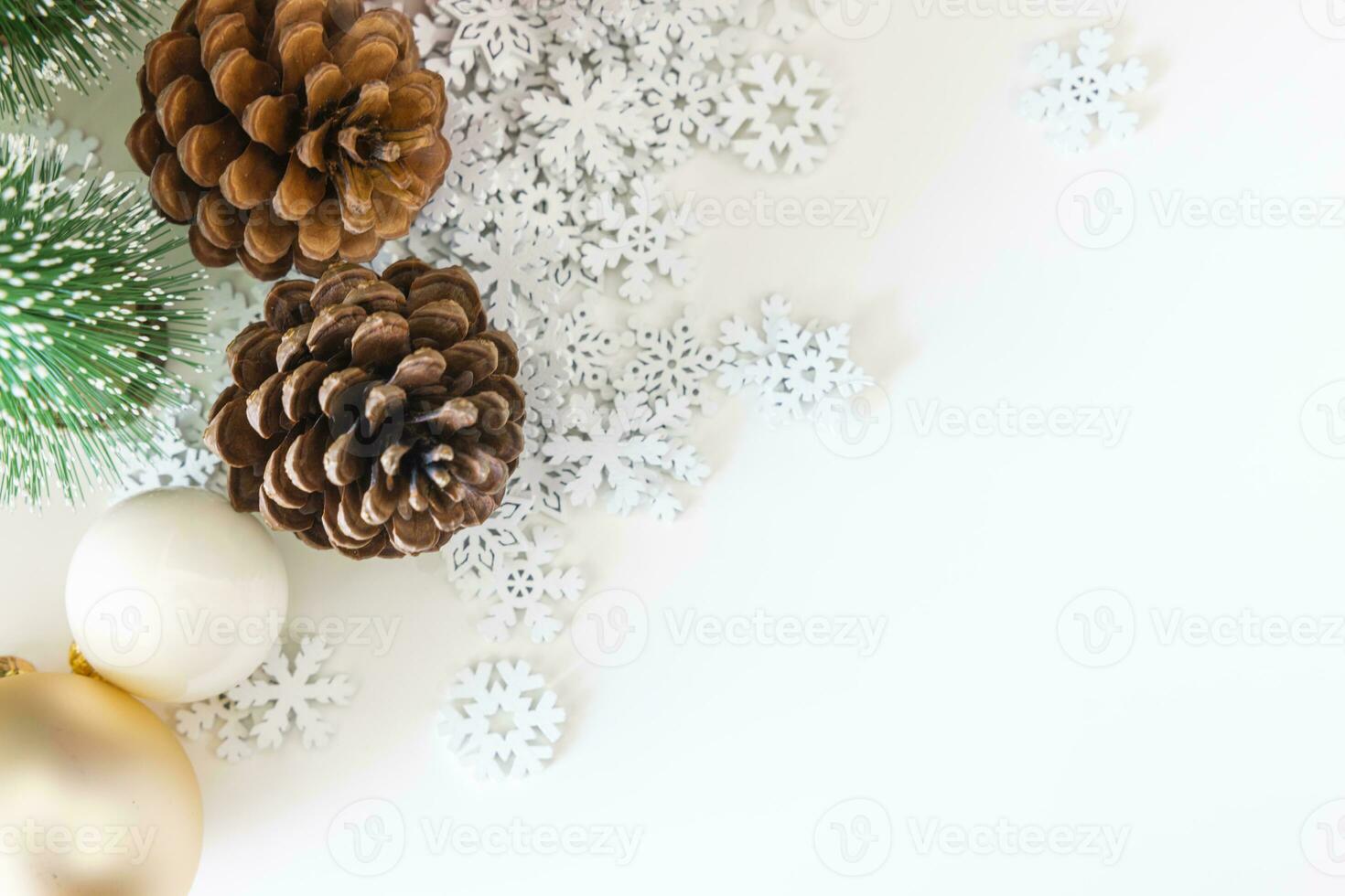 Top view festive scene is a beautiful Christmas tree adorned, with Christmas balls, pine cones, and a red house gift box tied with golden ribbon. Christmas mockup with space for text. photo