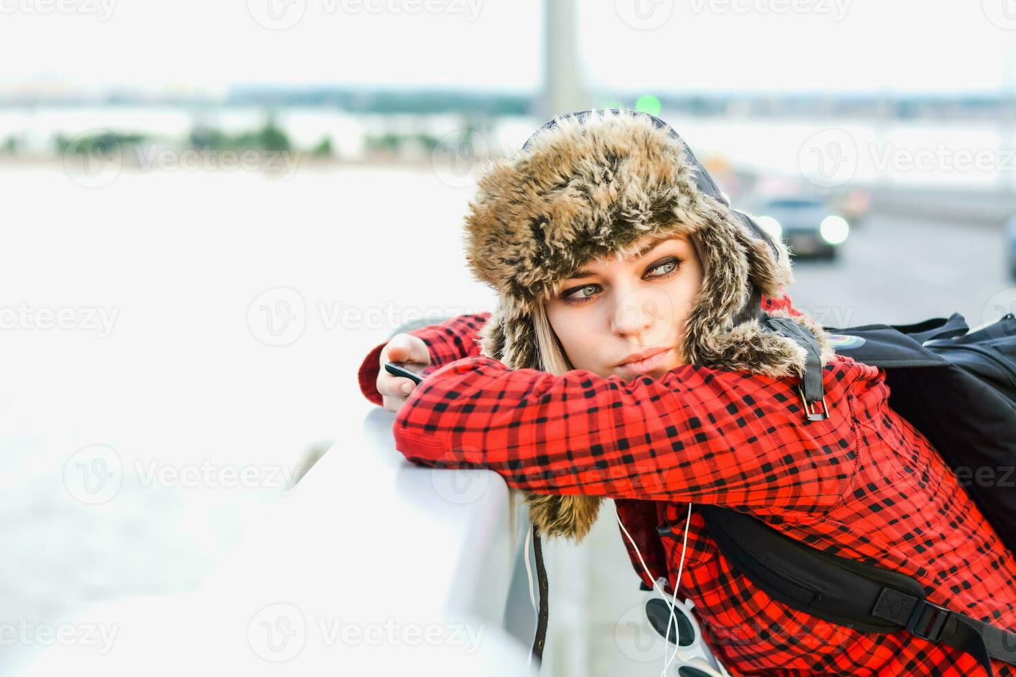 girl in a hat posing on the bridge photo