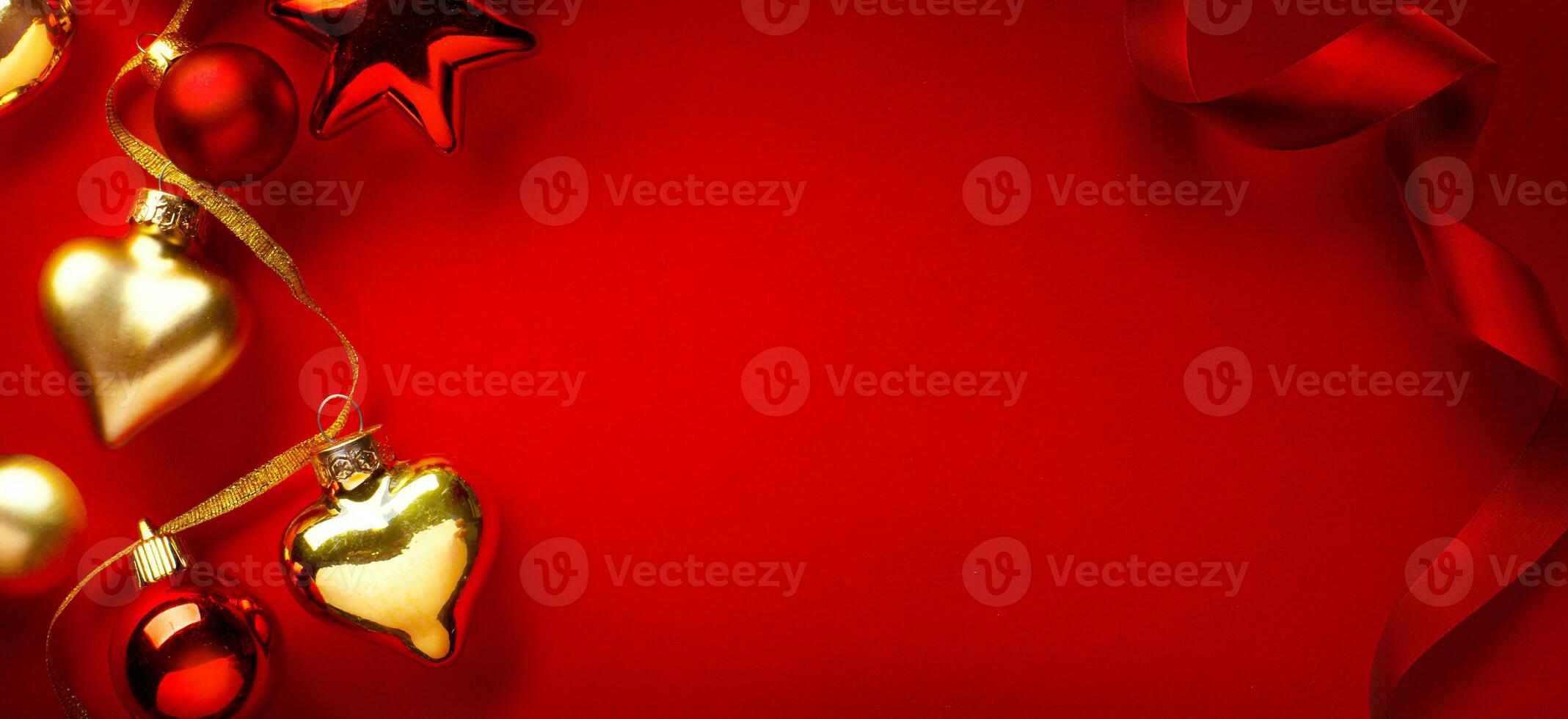 Merry Christmas and happy New Year banner or greeting card design. Christmas Tree Decorations on Red Background photo